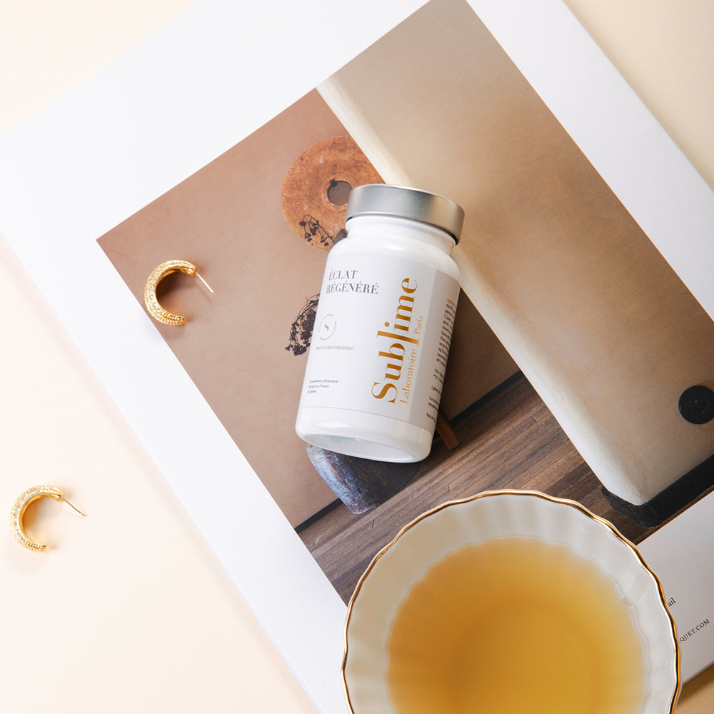 Laboratoire Sublime Rejuva Collagen supplement bottle with capsules and jewelry, French collagen beauty supplement, flat lay lifestyle view.