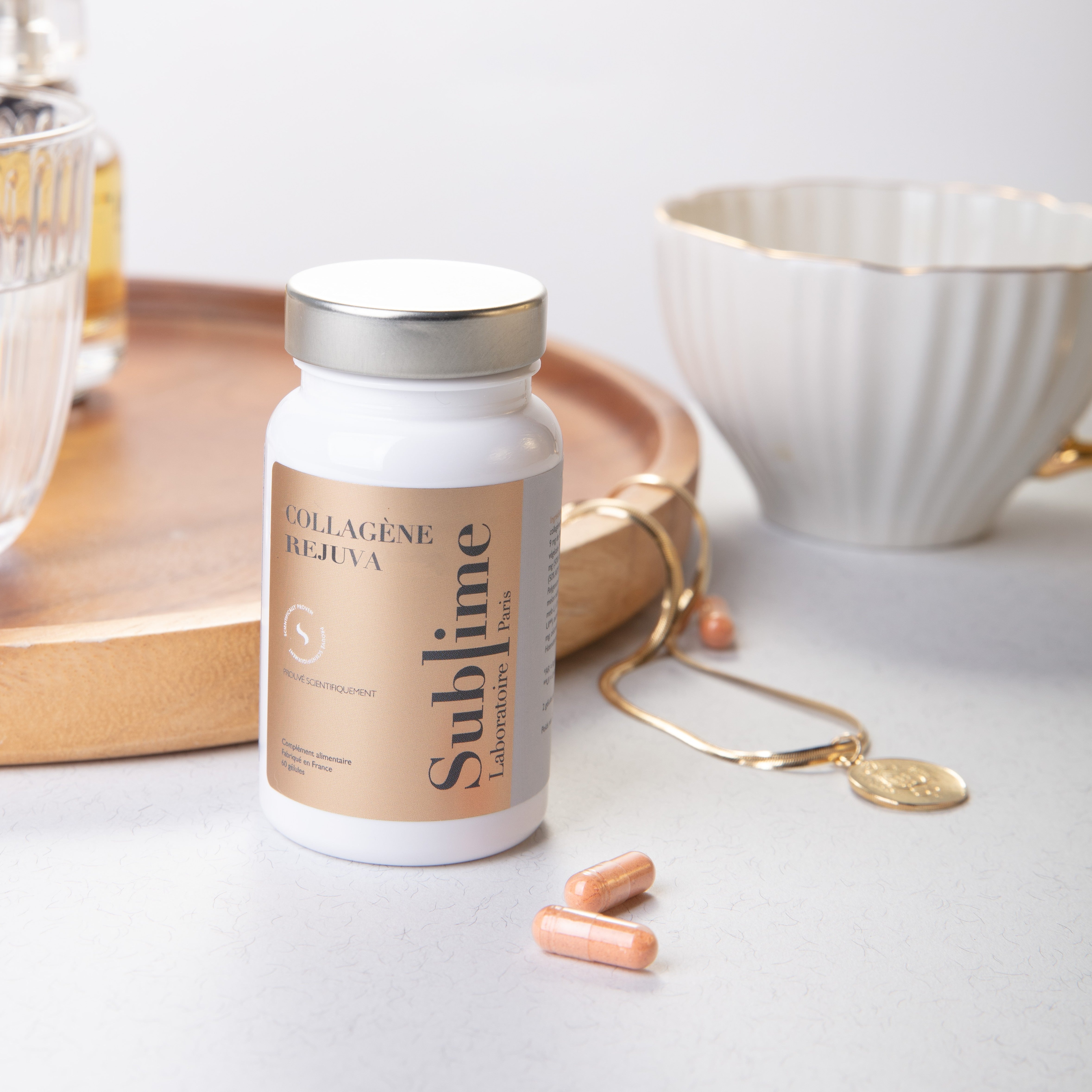 Laboratoire Sublime Rejuva Collagen supplement bottle, French collagen beauty supplement for skin firmness and glow, front angled view with capsules.